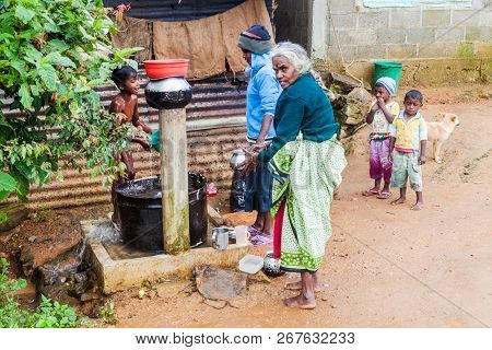 Nuwara Eliya, Sri Lanka - July 17, 2016: Local People At A Water Pump Near Nuwara Eliya Town.