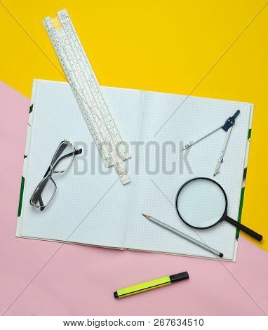 A Large Notebook For Notes And Drafting With Stationery Objects For A Student On A Yellow Background