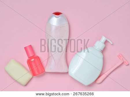 A Bottle Of Fragrant Perfume, Lotion, Shampoo, Soap, Razor. Products For The Care Of Body, Hair And 
