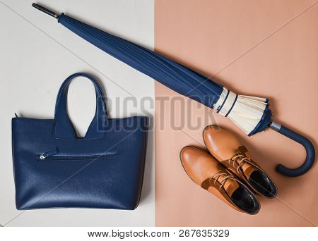Autumn Collection Of Women's Accessories And Shoes. Demi-season Boots, An Umbrella, A Leather Bag On