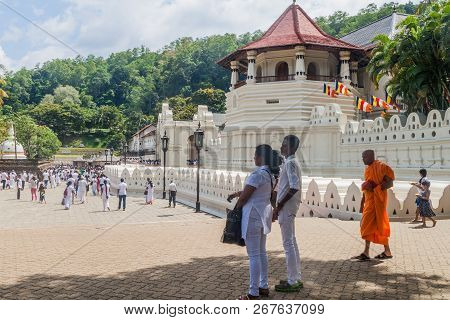 Kandy, Sri Lanka - July 19, 2016: White Clothed Buddhist Devotees Visit Temple Of The Sacred Tooth R