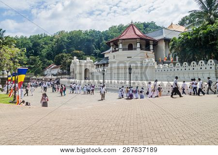 Kandy, Sri Lanka - July 19, 2016: White Clothed Buddhist Devotees Visit Temple Of The Sacred Tooth R