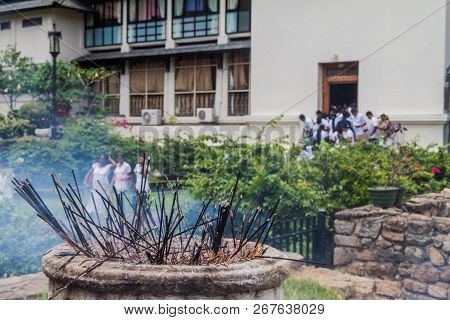 Incense Sticks Burn At The Grounds Of The Temple Of Sacred Tooth Relic During Poya Full Moon Holiday
