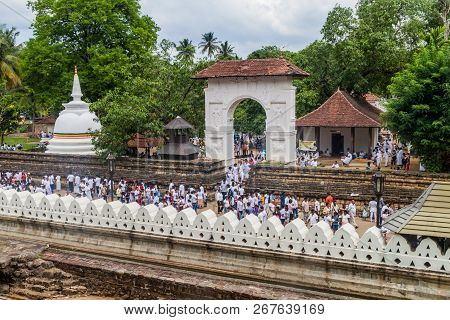 Kandy, Sri Lanka - July 19, 2016: White Clothed Buddhist Devotees At The Grounds Of The Temple Of Sa
