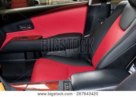 Interior Of The Suv Car With A Rebuilt Leather In Red-black Color In Exchange For The Old Worn-out I