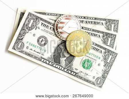 Prostejov Czech Rep. 8th November 2018 Shiny Bitcoin And Litecon Laying On One Dollar Notes.