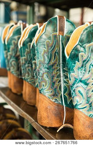 ST-TITES,CANADA-JULY 14, 2018:     Turquoise cowboy boots in preparation at the factory Boulet,  the oldest western boot company in North America that has been owned by the same family continuously.