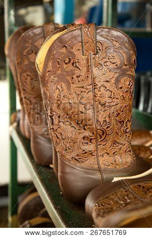 ST-TITES,CANADA-july 14, 2018:     Turquoise cowboy boots in preparation at the factory Boulet,  the oldest western boot company in North America that has been owned by the same family continuously.