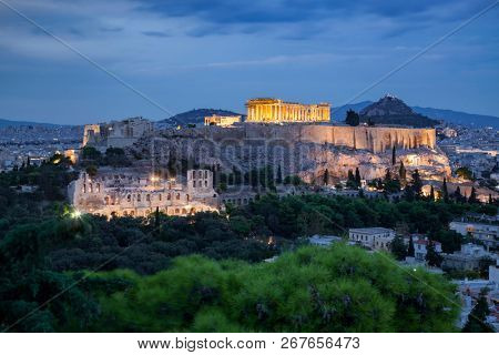 athens seen from Philopapou hill with views to Herodium , Acropolis and the Parthenon at blue hour, Attica, Greece