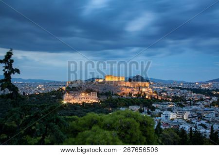 athens seen from Philopapou hill with views to Herodium , Acropolis and the Parthenon at blue hour, Attica, Greece