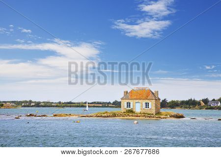 A Small Island With A Cottage On It In The Etel River, Ile De Saint-cado, Brittany, France.