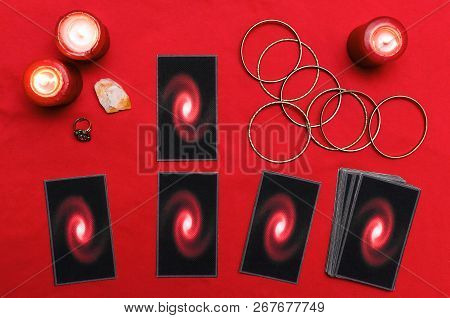Tarot Cards On The Red Table Cloth On Fortune Teller Table Background. Futune Reading Concept.
