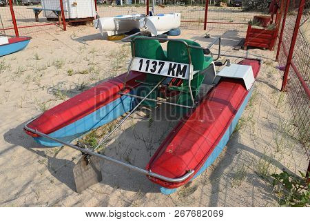 Catamaran On The Beach. The Boat, Driven By Pedals.
