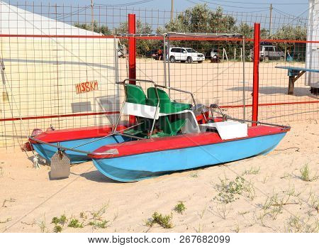 Catamaran On The Beach. The Boat, Driven By Pedals.