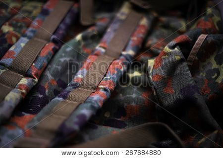 Military Camouflage Roomy Backpack. In The Frame Of The Strap And The Back Of A Backpack. Close-up V
