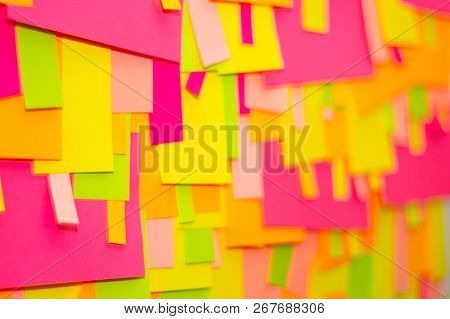 Bright Multi-colored Stickers On The Office White Board.