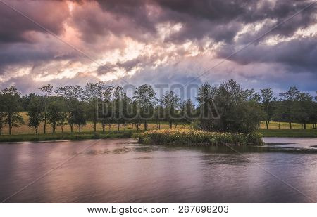 Strba Pond With Little Flower Island And Tree Row At Cloudy Sunset, Slovakia.