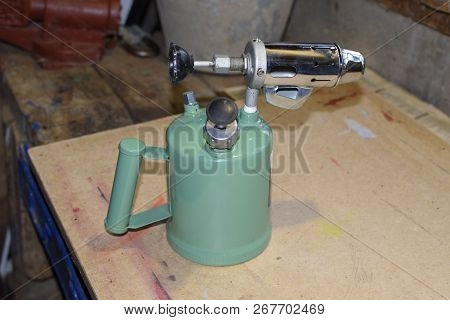 Blowtorch, General View. Blowtorch With A Green Tank