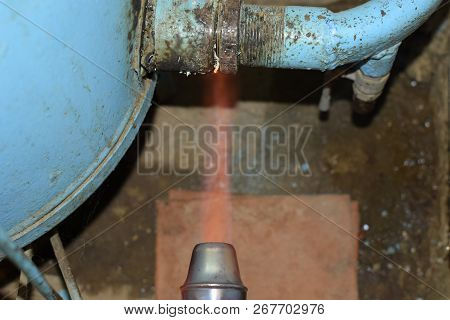 Heating A Steel Pipe With A Blowtorch. The Flame Of A Blowtorch.