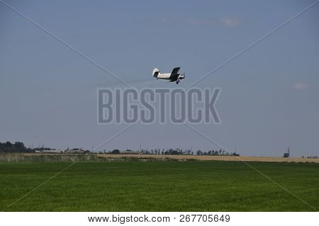 Aircraft Agricultural Aviation An-2. The Spraying Of Fertilizers And Pesticides On The Field With Th