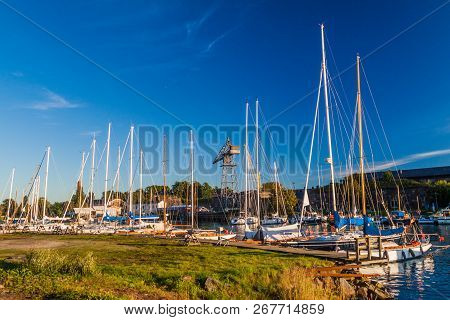 Sail Boats In A Harbor At Suomenlinna Sveaborg , Sea Fortress Near Helsinki, Finland