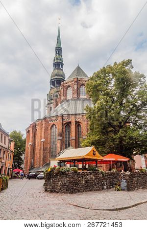 Riga, Latvia - August 19, 2016: View Of Skarnu Iela Street And St Peters Church In The Center Of Rig