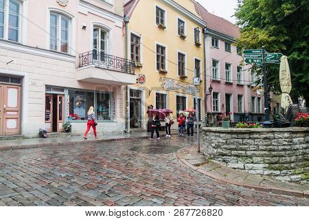Tallinn, Estonia - August 22, 2016: People Walk Along Cobbled Pikk Street In The Old Town Of Tallinn