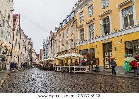 Tallinn, Estonia - August 22, 2016: People Walk Along Cobbled Pikk Street In The Old Town Of Tallinn