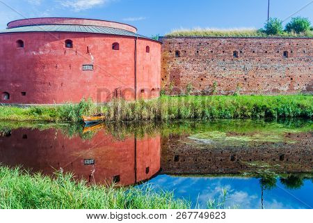 Fortification Walls Of Malmo Castle Reflecting In Its Moat, Sweden