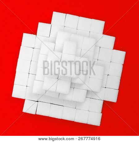 Pile Of Sugar Cubes, Isolated On Red