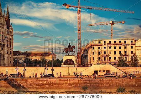 Budapest, Hungary, July 2018. View Of The Embankment Near The Hungarian Parliament And The Statue Of