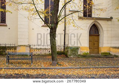 Side Door Of Gothic Church In Zatec Town. Autumn. Czech Republic.