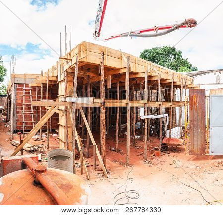 Construction Of A Masonry House. House Made Of Bricks, Steel Rebars And Concrete. Structural Parts O