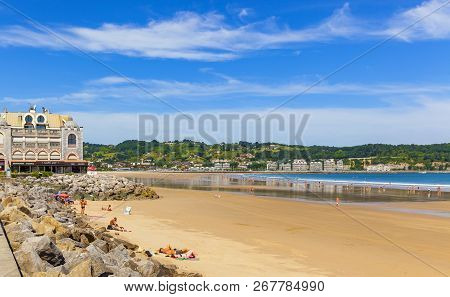 Hendaye, France - June 8: Tourists And Surfers Enjoy The Beach Of The Charming Seaside Resort Of Hen