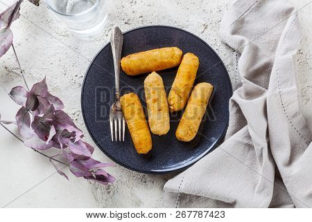 Latin-american Appetizers Called Tequenos Made Of Fried Corn Filled With Cheese.