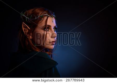 Crop Of Beautiful Girl In Dark Green Standing Back To Camera. Portrait Of Gorgeous And Elegant Queen
