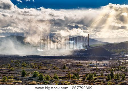 Environmental Disaster. Copper Plant In Valley Against The Background Of The Mountains, Toxic Smoke 