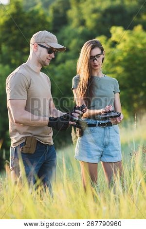 The Instructor Teaches The Girl To Shoot A Pistol At The Range