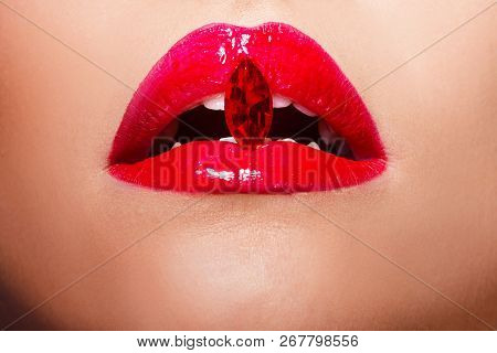 Red Lips Covered With Rhinestones. Beautiful Woman With Red Lipstick On Her Lips, Concept Cosmetics
