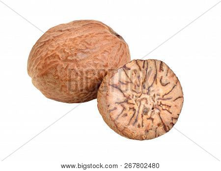 Nutmeg, Fragrant Nutmeg Or True Nutmeg. Whole Nut And Half. Isolated On White Background
