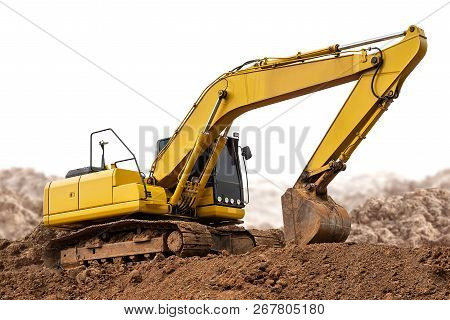 Model Of Excavator Backhoe On The Ground Isolated On White Background With Clipping Path