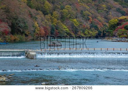 Togetsukyo Bridge In Arashiyama, Kyoto Prefecture, Japan During Koyo Vibrant Autumn Foliage Festival