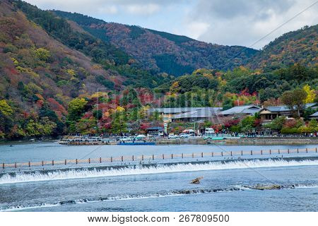 Togetsukyo Bridge In Arashiyama, Kyoto Prefecture, Japan During Koyo Vibrant Autumn Foliage Festival