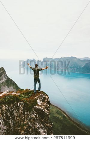 Traveler Man Alone On Cliff Mountain Above Sea Adventure Lifestyle Summer Vacations Tourist Raised H