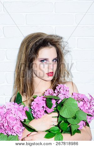 Woman With Fashion Makeup Hold Spring Flowers. Makeup Cosmetics And Skincare. Fashion Jewelry And Ac