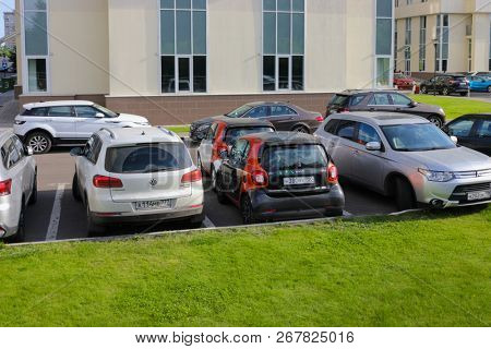 MOSCOW - JUN 22, 2018: Two Mercedes Smart cars of Moscow carsharing company You drive among other cars, carsharing is system of short-term car rental