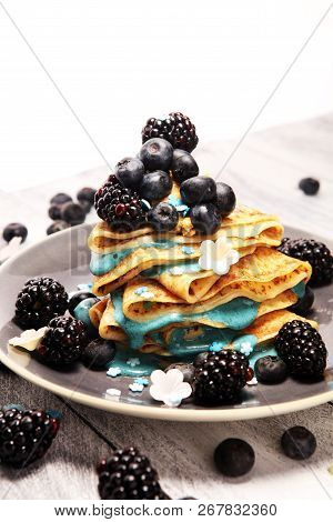 Delicious Tasty Homemade Crepes Or Pancakes With Blackberries,blueberries And Blue Spirulina Nicecre