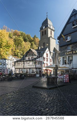 Monschau, Germany, October 2018 - Picturesque Buildings And Church In The Market Square In The Histo