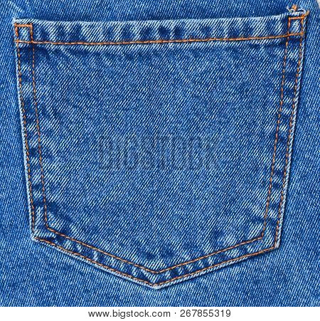 Back Pocket Of Blue Textured Jeans Isolated On White Background.