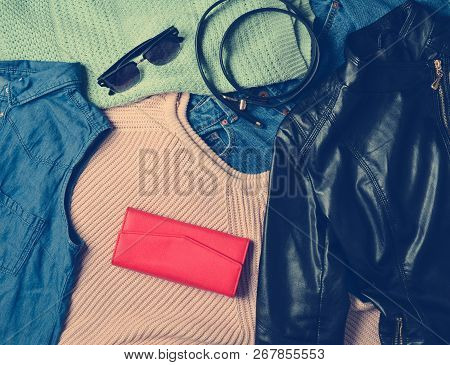 A Lot Of Diverse Women's Clothing And Accessories. Sweater, Denim Shirt, Jeans, Leather Jacket, Purs